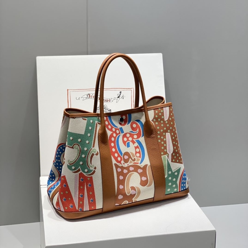 H**mes shopping bags
